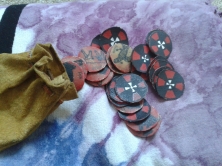 Divining coins and leather pouch